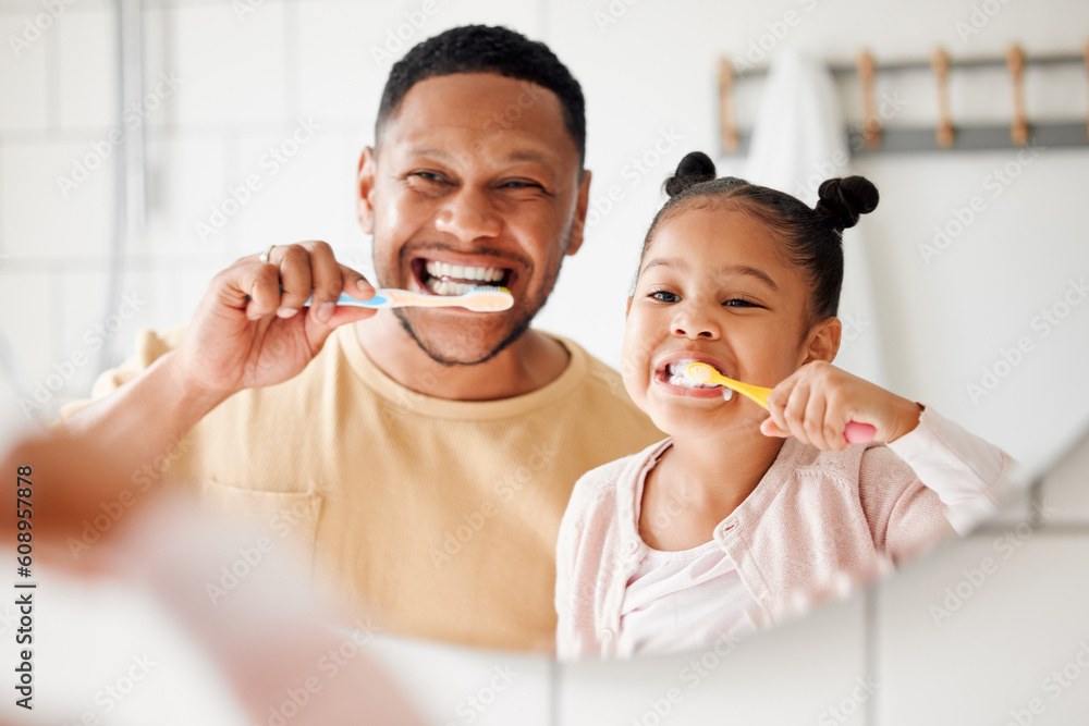 Child, dad and brushing teeth in a family home bathroom for dental health and wellness in a mirror. Face of african man and girl kid learning to clean mouth with toothbrush and smile for oral hygiene